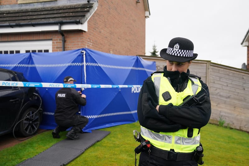 Several police vehicles are parked outside the Glasgow home of Peter Murrell and Nicola Sturgeon, and a blue police tent has been put up in the front garden.