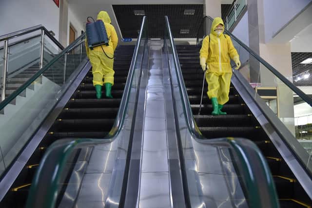 Disinfectant is sprayed inside a department store in Pyongyang (Picture: Kim Won Jin/AFP via Getty Images)