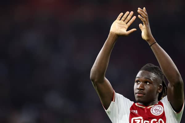 Ajax defender Calvin Bassey applauds supporters after his team's 4-0 victory over his former club Rangers. (Photo by KENZO TRIBOUILLARD/AFP via Getty Images)