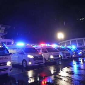 Ambulances wait to carry passengers from a London-Singapore flight that encountered severe turbulence, after it landed in Bangkok, Thailand.