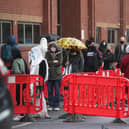 People queuing in the car park for a vaccination at the Glasgow Central Mosque in Glasgow.