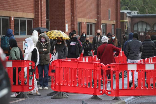 People queuing in the car park for a vaccination at the Glasgow Central Mosque in Glasgow.
