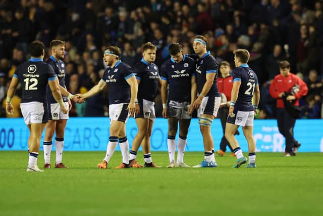 Scotland's Blair Kinghorn is comforted by captain Jamie Ritchie after missing a game-winning penalty in the last minute