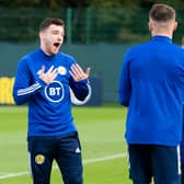 Andy Robertson shares a lighter moment during training as Scotland prepare to face the Faroe Islands.