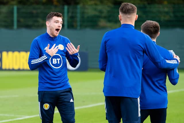 Andy Robertson shares a lighter moment during training as Scotland prepare to face the Faroe Islands.