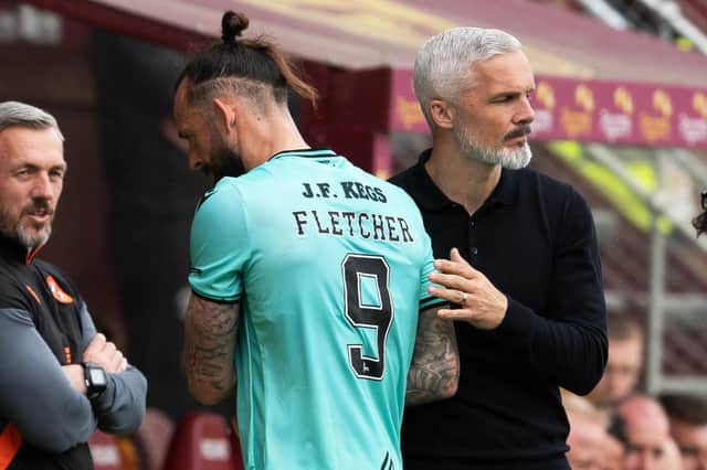 Dundee Utd's Steven Fletcher shakes hands with manager Jim Goodwin after being substituted in the 3-2 defeat to Motherwell that confirmed the club's relegation. (Photo by Craig Foy / SNS Group)