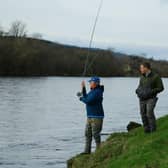 Tiggy Pettifer making the ceremonial 1st cast on the Crathes Castle beat with Al Peake as her Ghillie.