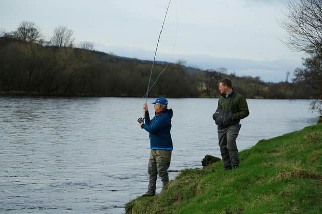 Tiggy Pettifer making the ceremonial 1st cast on the Crathes Castle beat with Al Peake as her Ghillie.