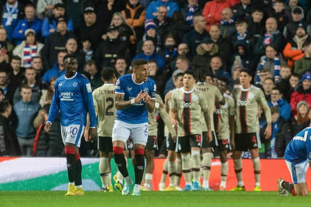 Rangers' James Tavernier tries to motivate the squad as Ajax celebrate making it 2-0.
