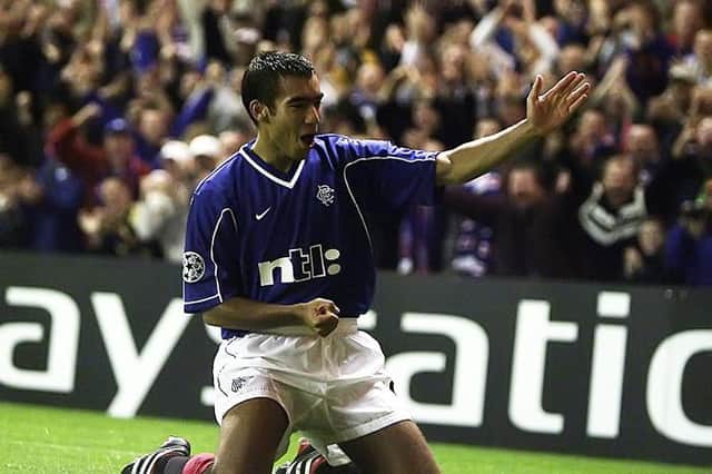 Giovanni van Bronckhorst celebrates scoring for Rangers in a Champions League victory over Sturm Graz at Ibrox in September 2000. (Photo by SNS Group).