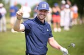 Connor Syme celebrates his hole in one on the second hole during day three of the BMW International Open at Golfclub Munchen Eichenried in Germany. Picture: Stuart Franklin/Getty Images.