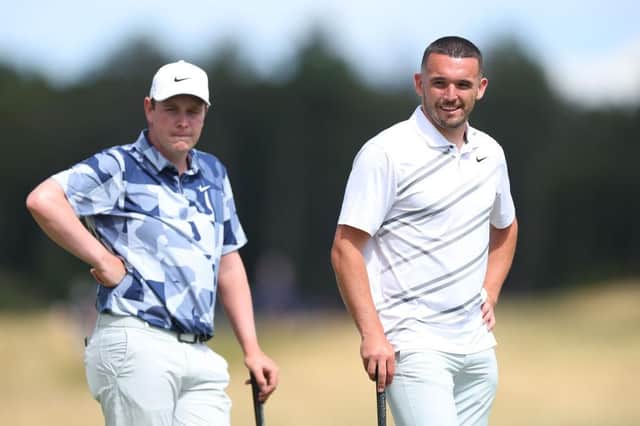 Bob Macintyre and John McGinn look on as one of the other players in their group hits a shot in the Genesis Scottish Open Pro Am at The Renaissance Club. Picture: Andrew Redington/Getty Images.