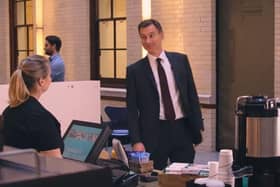 Jeremy Hunt channels Mr Bean as he orders a coffee in a new Treasury video about inflation (Picture: HM Treasury)