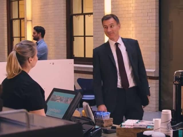 Jeremy Hunt channels Mr Bean as he orders a coffee in a new Treasury video about inflation (Picture: HM Treasury)