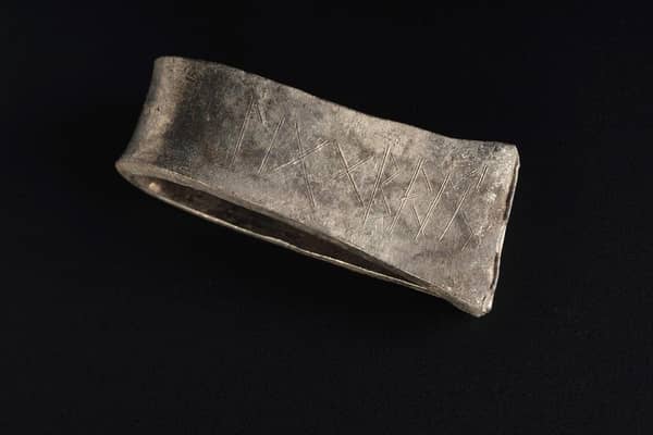 A Scandinavian-style silver arm ring found in the Viking-era Galloway Hoard with the runic inscription for the name Egbert, an Anglo Saxon name common in the kingdom of Northumbria. Picture: National Museums Scotland