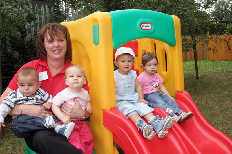 Bailey Owen,, Evie Smedley, Owen James and Leah Murfin, with manager Julia Mills, at Little Tykes nursery open day to raise funds for Childline in 2006.