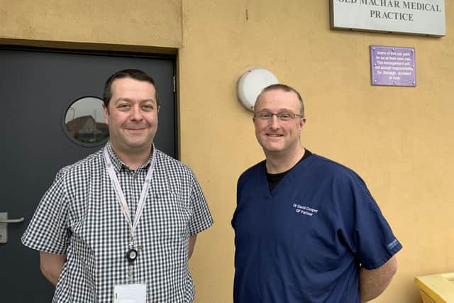 ​Paul Gray and David Cooper outside Old Machar Medical Practice.