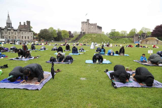 Muslims gather to perform the Eid Al-Fitr prayer, which follows the end of fasting and marks the end of the holy month of Ramadan, outside  Cardiff Castle in Cardiff, Wales in 2021. Photo: GEOFF CADDICK / AFP via Getty Images.