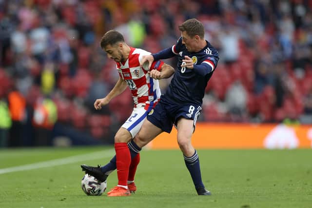Josip Juranovic tussles with Celtic captain Callum McGregor during the Euro 2020 finals group match between Croatia and Scotland at Hampden in June. (Photo by Lee Smith - Pool/Getty Images)