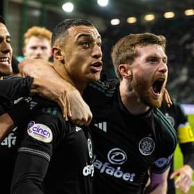 Celtic's Adam Idah celebrates with Anthony Ralston when scoring a late winner against Hibs from the spot.
