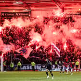 Rangers fans light up the Bob Shankly stand with pyro during the match against Dundee on Wednesday.