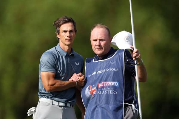 Thorbjorn Olesen of Denmark reacts on the 18th green with caddie Dom Bott during the third round of the Betfred British Masters hosted by Danny Willett at The Belfry. Picture: Richard Heathcote/Getty Images.