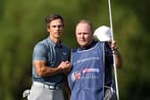 Thorbjorn Olesen of Denmark reacts on the 18th green with caddie Dom Bott during the third round of the Betfred British Masters hosted by Danny Willett at The Belfry. Picture: Richard Heathcote/Getty Images.