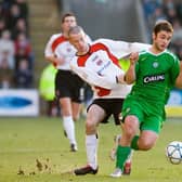Shaun Maloney (right) holds off Clyde's Eddie Malone in one of the competition's shocks in 2006.