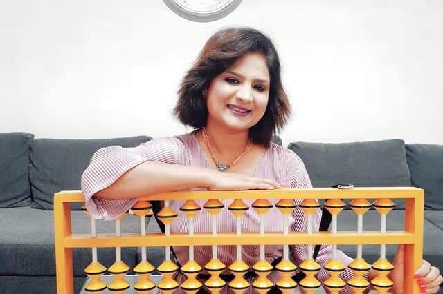 Company founder Rashmi Mantri with an abacus.