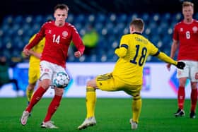 Denmark's Mikkel Damsgaard (L) and Sweden's Carl Starfelt vie for the ball (Photo by LISELOTTE SABROE/Ritzau Scanpix/AFP via Getty Images)
