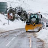 A snow plough clears the A939 after heavy snowfall in the Highlands.