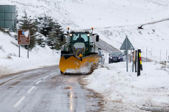 A snow plough clears the A939 after heavy snowfall in the Highlands.