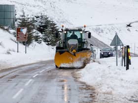 A snow plough clears the A939 after heavy snowfall in the Highlands.