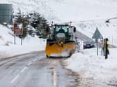 A snow plough clears the A939 after heavy snowfall in the Highlands.