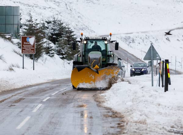 A snow plough clears the A939 after heavy snowfall in the Highlands.