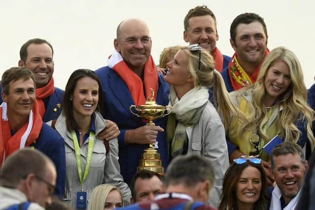 Thomas Bjorn celebrates with his players and their wives and partners after Europe's thumping win in the 42nd Ryder Cup at Le Golf National near Paris in 2018. Picture: Eric Feferberg/AFP via Getty Images.