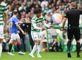 Beachballs blew from the stands onto the pitch, leading Celtic midfielder to Reo Hatate to intervene with one inflatable (Photo by Craig Foy / SNS Group)