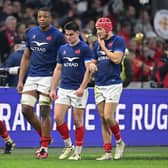The French players trudge off after their defeat by Ireland.