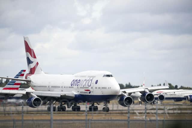 The parent company of British Airways expects its flight capacity from October to December to be no more than 30 per cent of what it was over the same period last year. This is down from its previous guidance. Picture: Steve Parsons/PA Wire