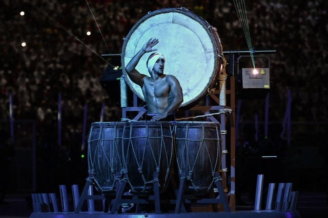 A drummer performs during the opening ceremony of the Qatar 2022 World Cup.