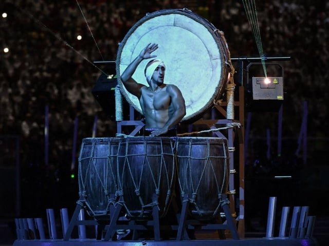A drummer performs during the opening ceremony of the Qatar 2022 World Cup.