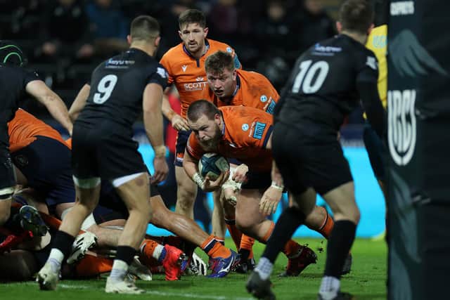 Boan Venter of Edinburgh dives over to score a try in the defeat to Ospreys. Photo by Chris Fairweather/Huw Evans/Shutterstock (12781376ad)