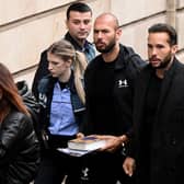 Former professional kickboxer and social media 'influencer' Andrew Tate (third from right) and his brother Tristan Tate (second from right) arrive at a courthouse in Bucharest on Tuesday (Picture: Daniel Mihailescu/AFP via Getty Images)