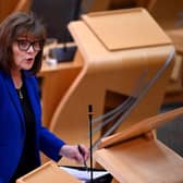 Stock photo of Jeane Freeman addressing MSPs in the Scottish Parliament
