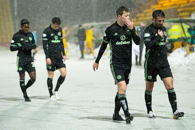 Celtic's players trudge off after the draw at Livingston.