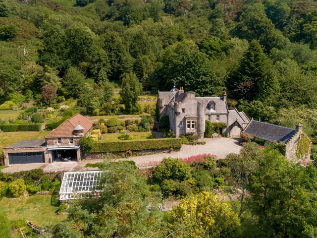 Exterior: South-facing gardens are protected by mature trees. There is a one-bedroom cottage and former stables with garages in the grounds.
Contact: Savills