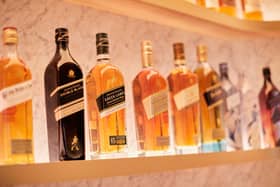 FTSE-100 spirits giant Diageo has a vast portfolio that includes Johnnie Walker whisky, pictured. The group has almost 30 malt distilleries in Scotland.