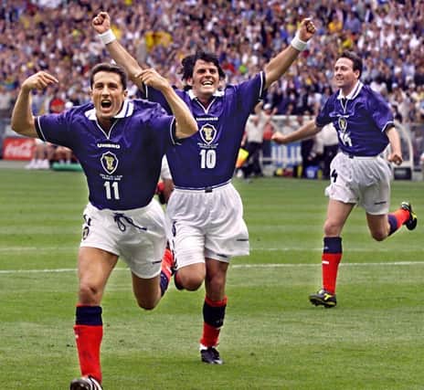 John Collins, with Darren Jackson sharing the jubilation, sets off on a celebration following his penalty equaliser against Brazil in the France 98 opener that he now as certain regrets over.  (Photo credit: Toshifumi  Kitamura /AFP via Getty Images)