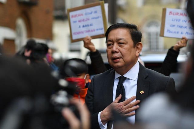 Myanmar's Ambassador to the United Kingdom, Kyaw Zwar Minn addresses the media outside the Myanmar Embassy in London on April 8, 2021.