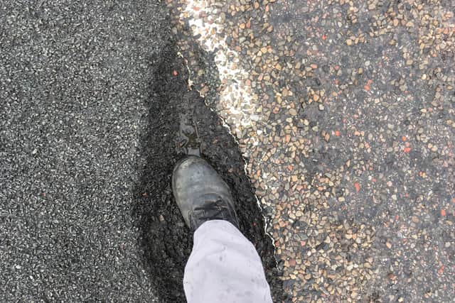 Some potholes on the A836 section between Tongue and Bettyhill are large enough to stand in. Picture: Pete Malone